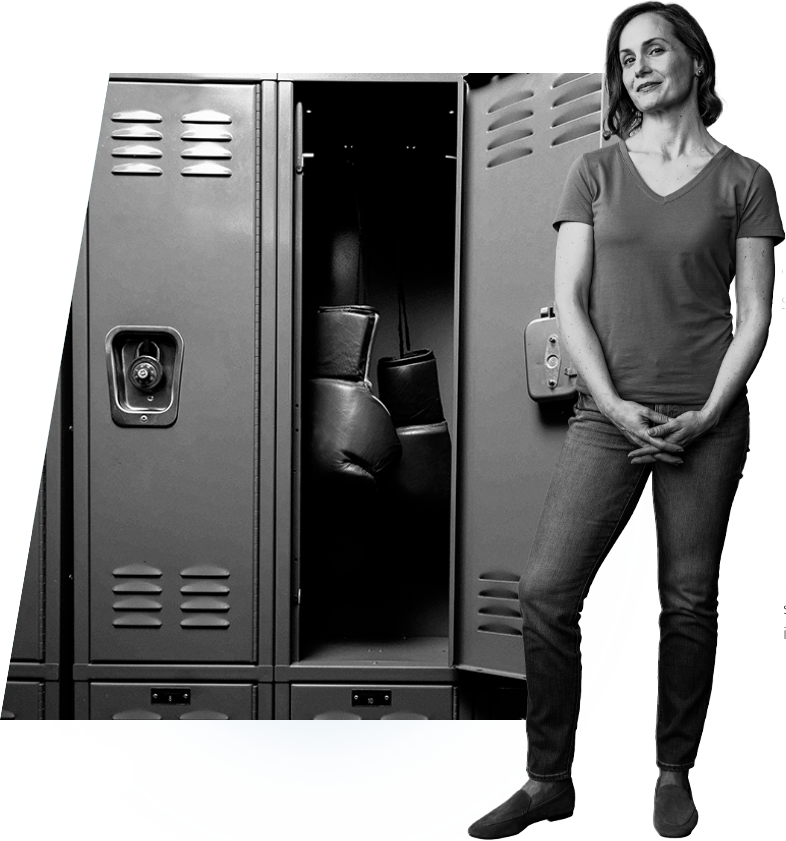 Melissa standing in front of a gym locker