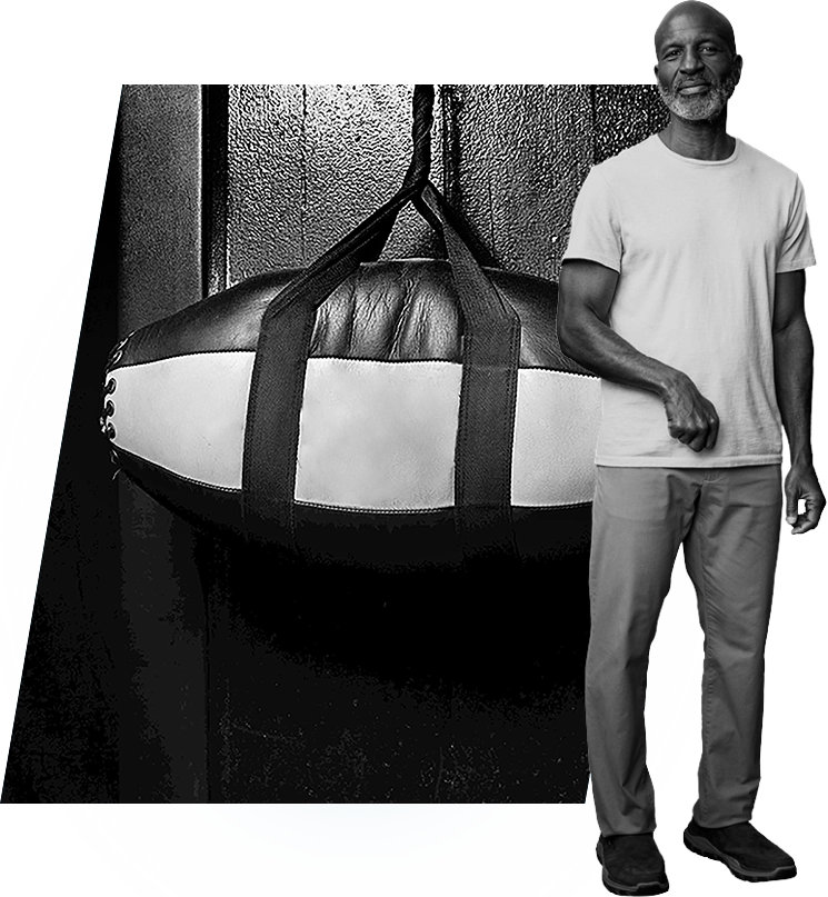 Russell standing next to a punching bag